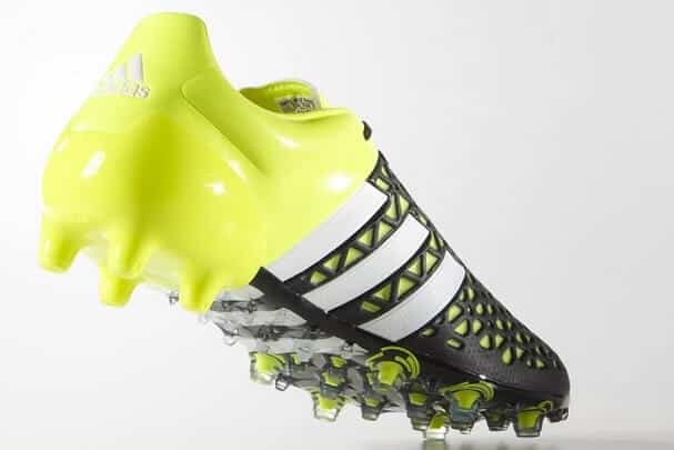 black and yellow adidas football boots